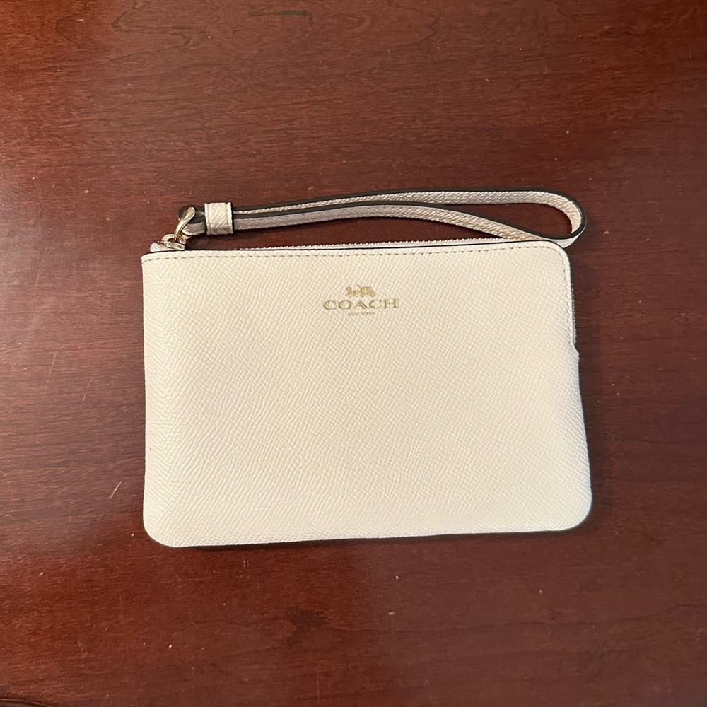 coach corner zip wristlet- cream color